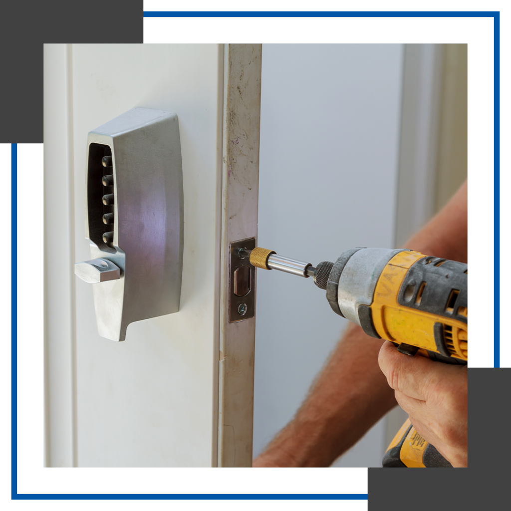  Image of a locksmith installing an electronic keypad. 