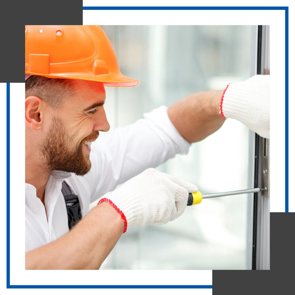 Image of a commercial locksmith working on a door