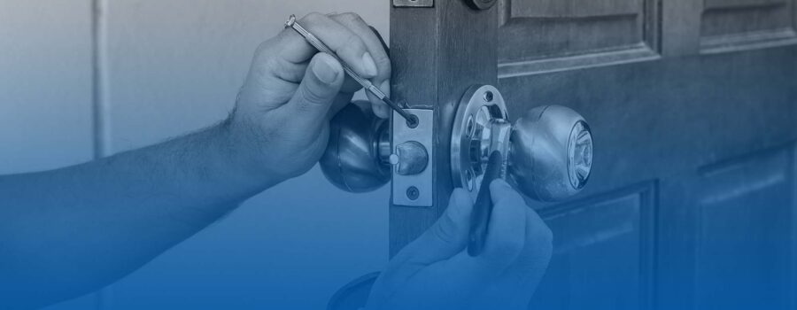 Image of a locksmith working on a lock.