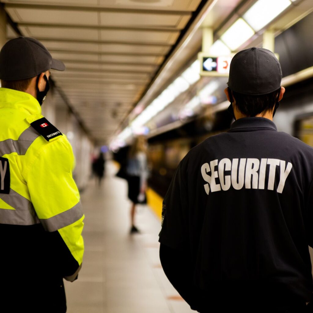 security men walking down sidewalk