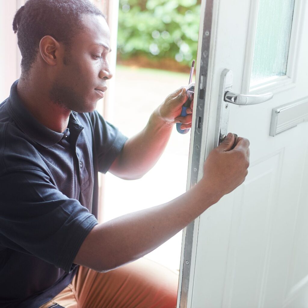 locksmith assessing door handle