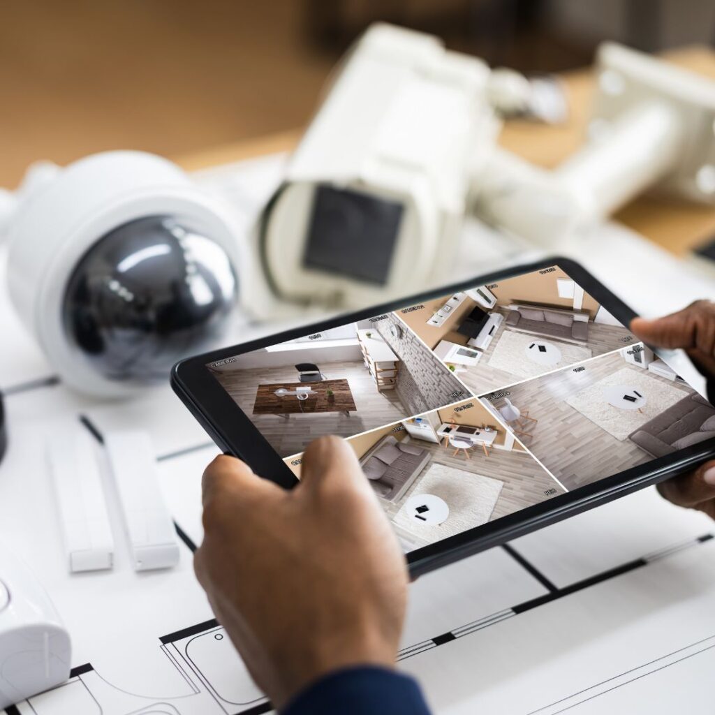 person observing security video footage on tablet