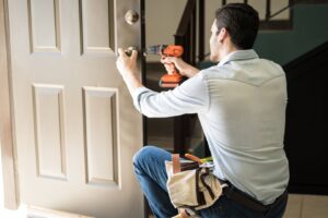 locksmith working on residential door