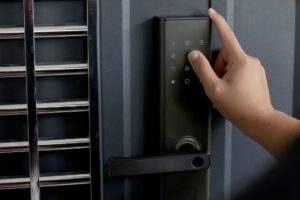 a person using a keypad door lock